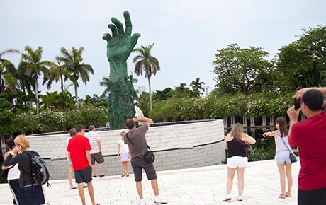 Group taking photos at the Holocaust Memorial