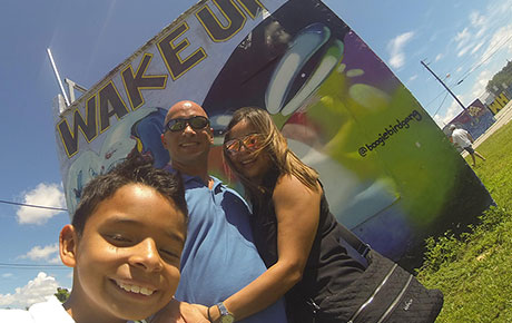 Taking a selfie at the Wake Up mural