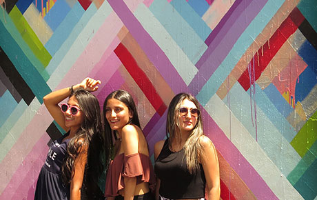 Friends posing at Maya Hayuk’s Wall